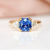 blue sapphire and diamond three-stone ring