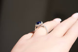 Close-up royal blue sapphire diamond engagement ring