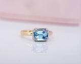 Emerald cut sapphire ring in natural light