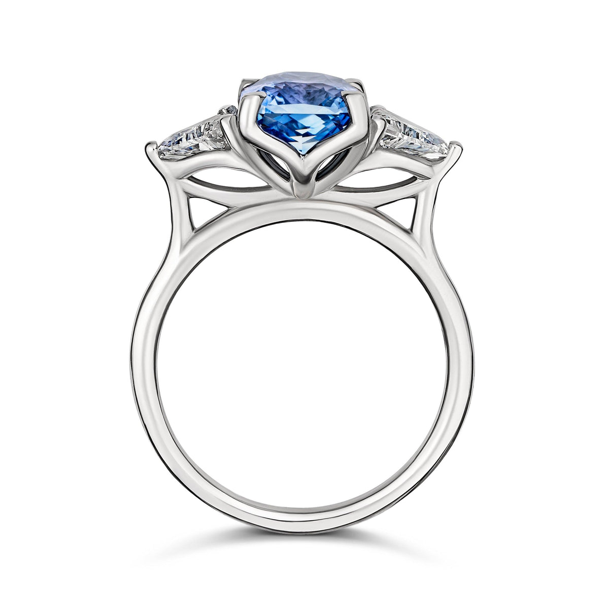 Medium blue sapphire engagement ring with trillion diamonds