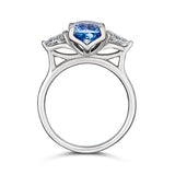 Medium blue sapphire engagement ring with trillion diamonds