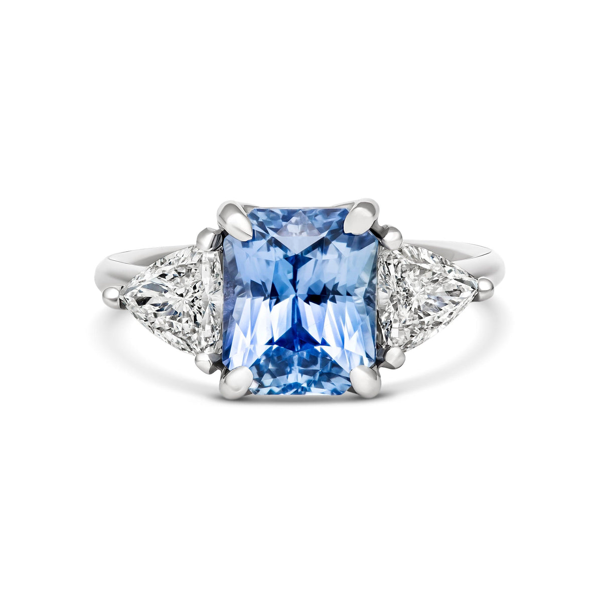 Radiant cut Ceylon sapphire and diamond three-stone ring