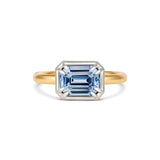 Unheated emerald cut blue sapphire two-tone engagement ring