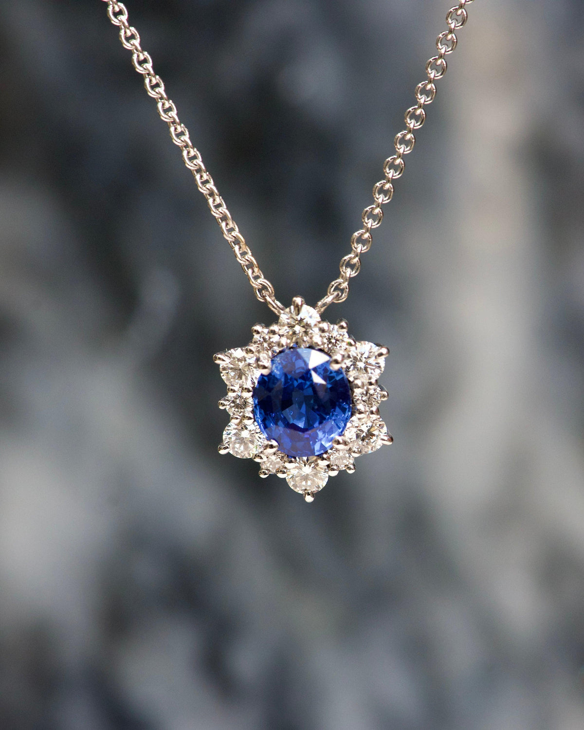Ceylon blue sapphire diamond halo pendant, close-up