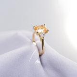 Apricot Sapphire Trapezoid Diamond Trilogy Engagement Ring