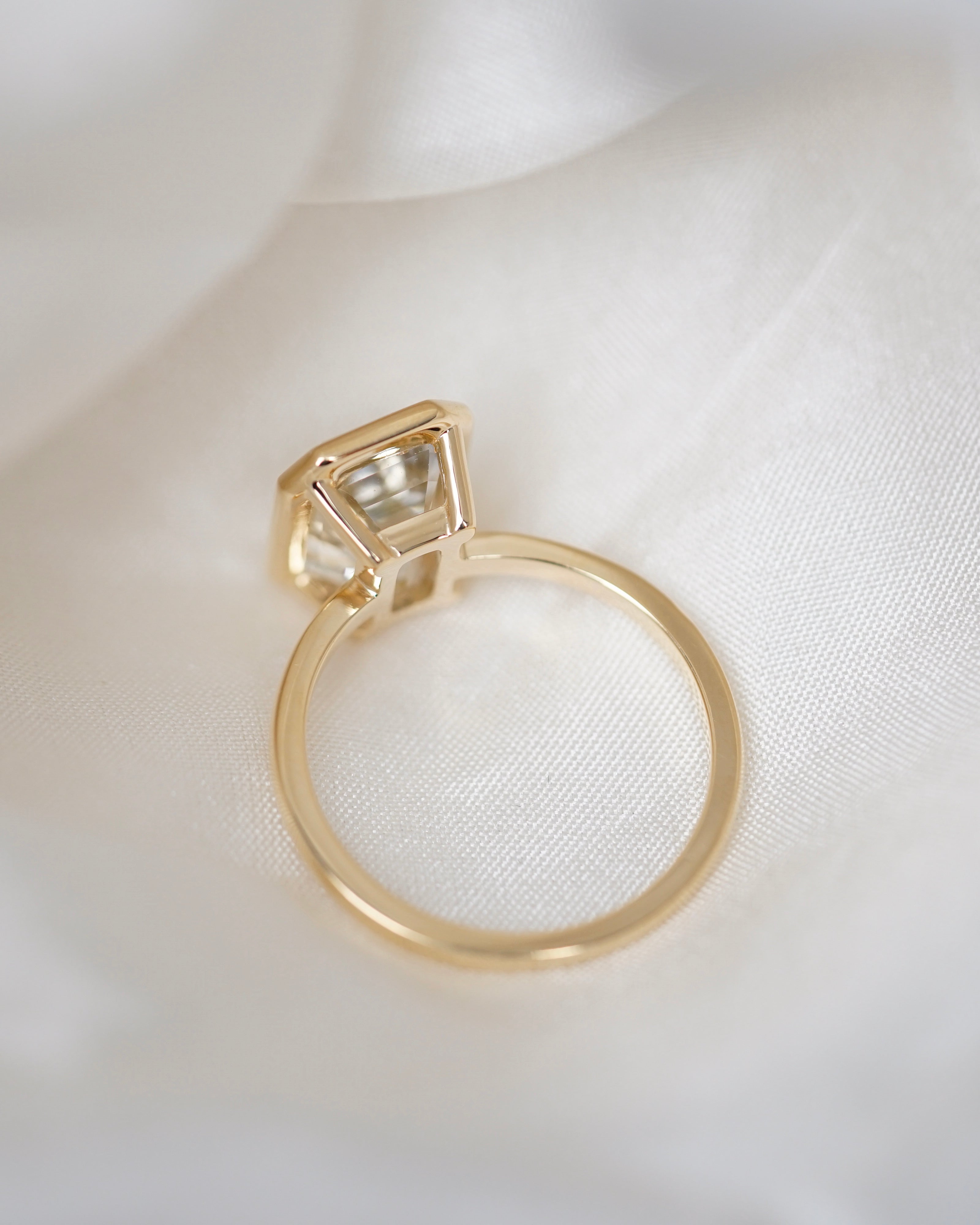 Champagne sapphire bezel ring side view showing gallery