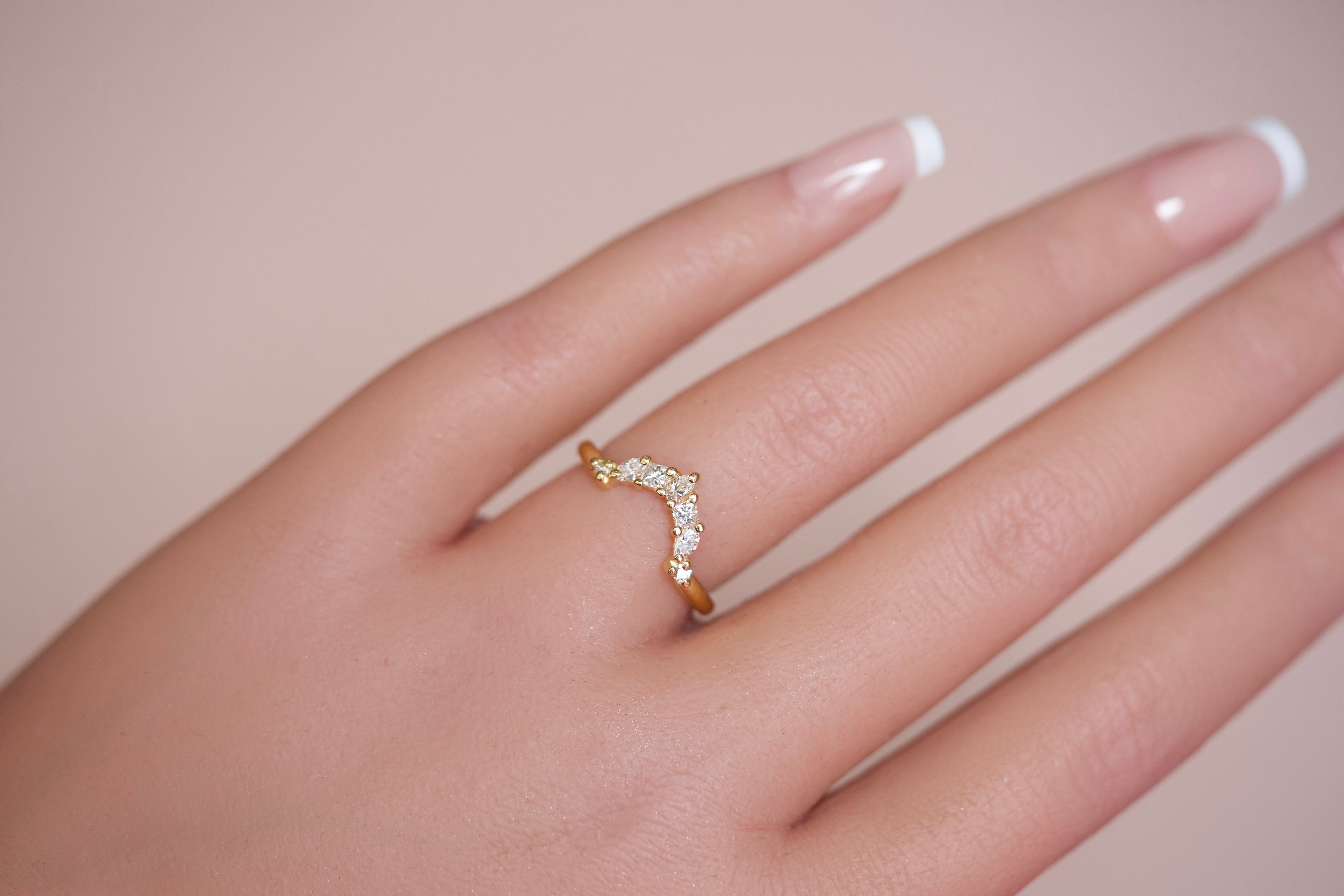 Crown wedding band with mixed diamonds on hand