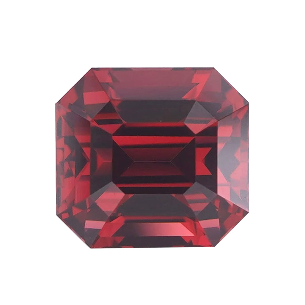 Orangish pink octagonal emerald cut rhodolite garnet loose stone.