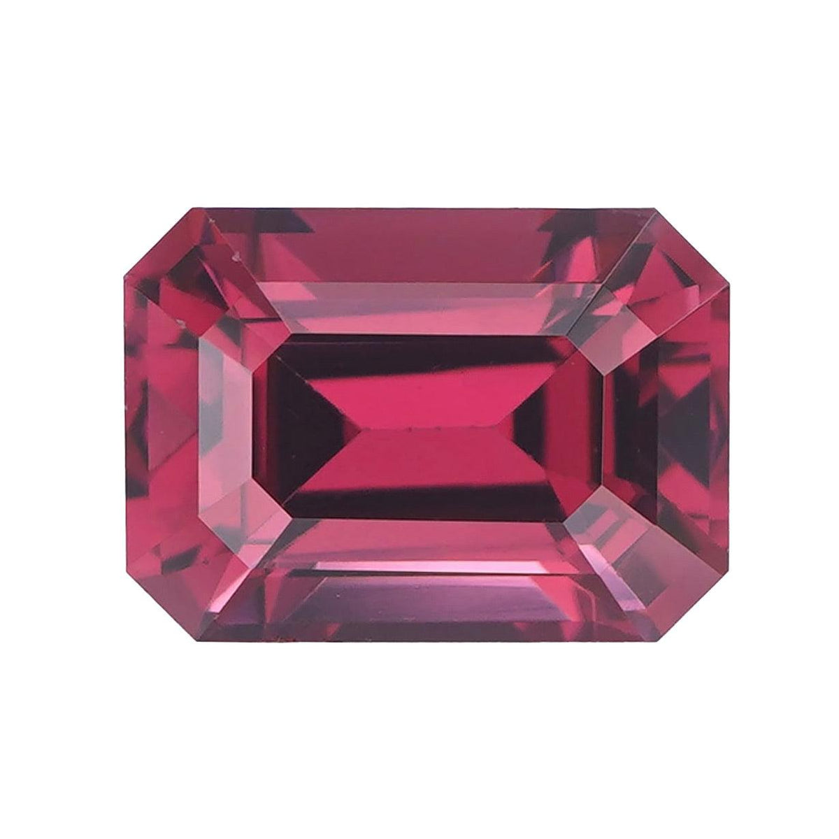 Face-up shot of a loose purplish pink emerald cut garnet.