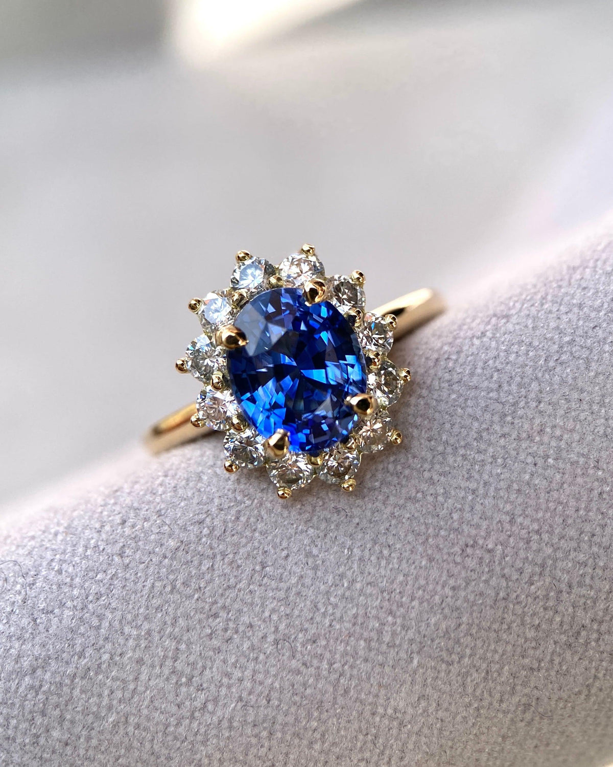 Close up view of a handcrafted 2.54 carat blue sapphire ring showcasing premium diamond claws