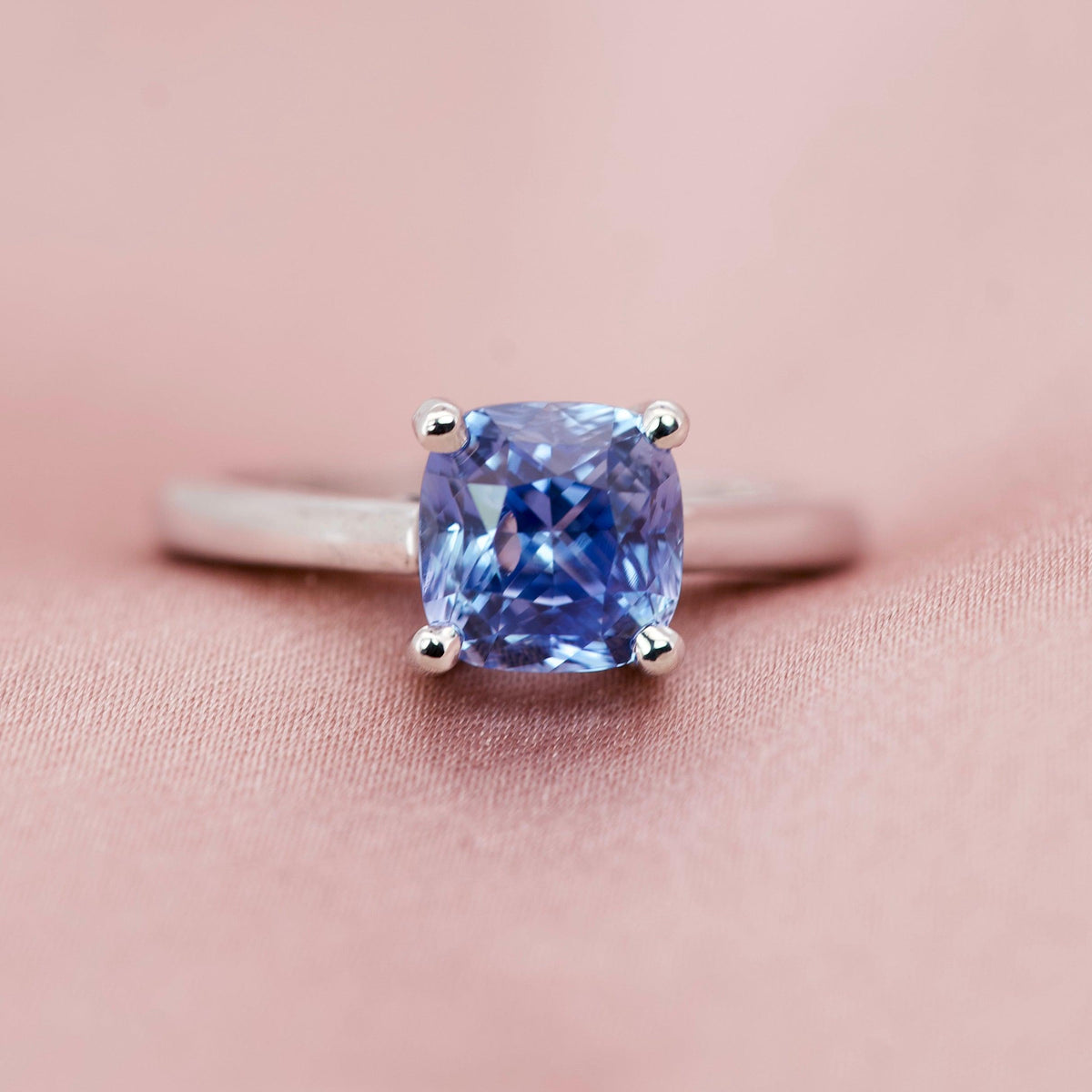 Macro shot of a cornflower blue cushion sapphire highlighting its natural unheated brilliance