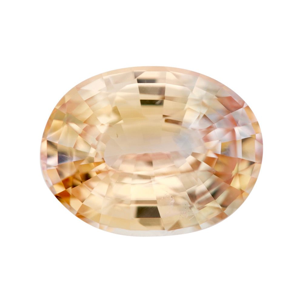 Vibrant orangy-yellow oval sapphire