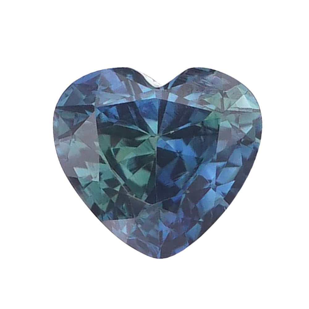 Heart-cut blue-green teal sapphire loose gemstone on a plain white background.
