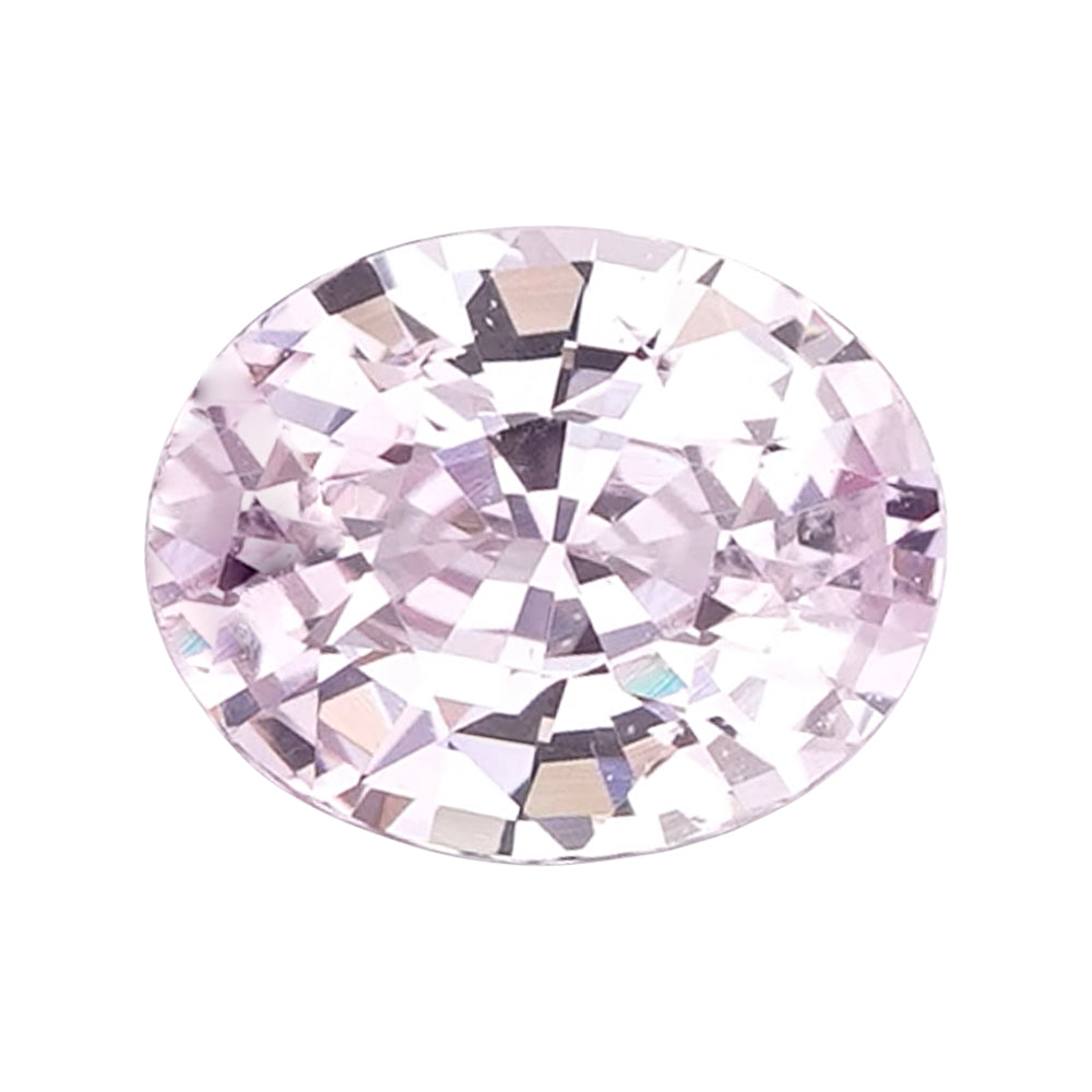 Extremely pale pink oval mixed-cut loose stone isolated on white.