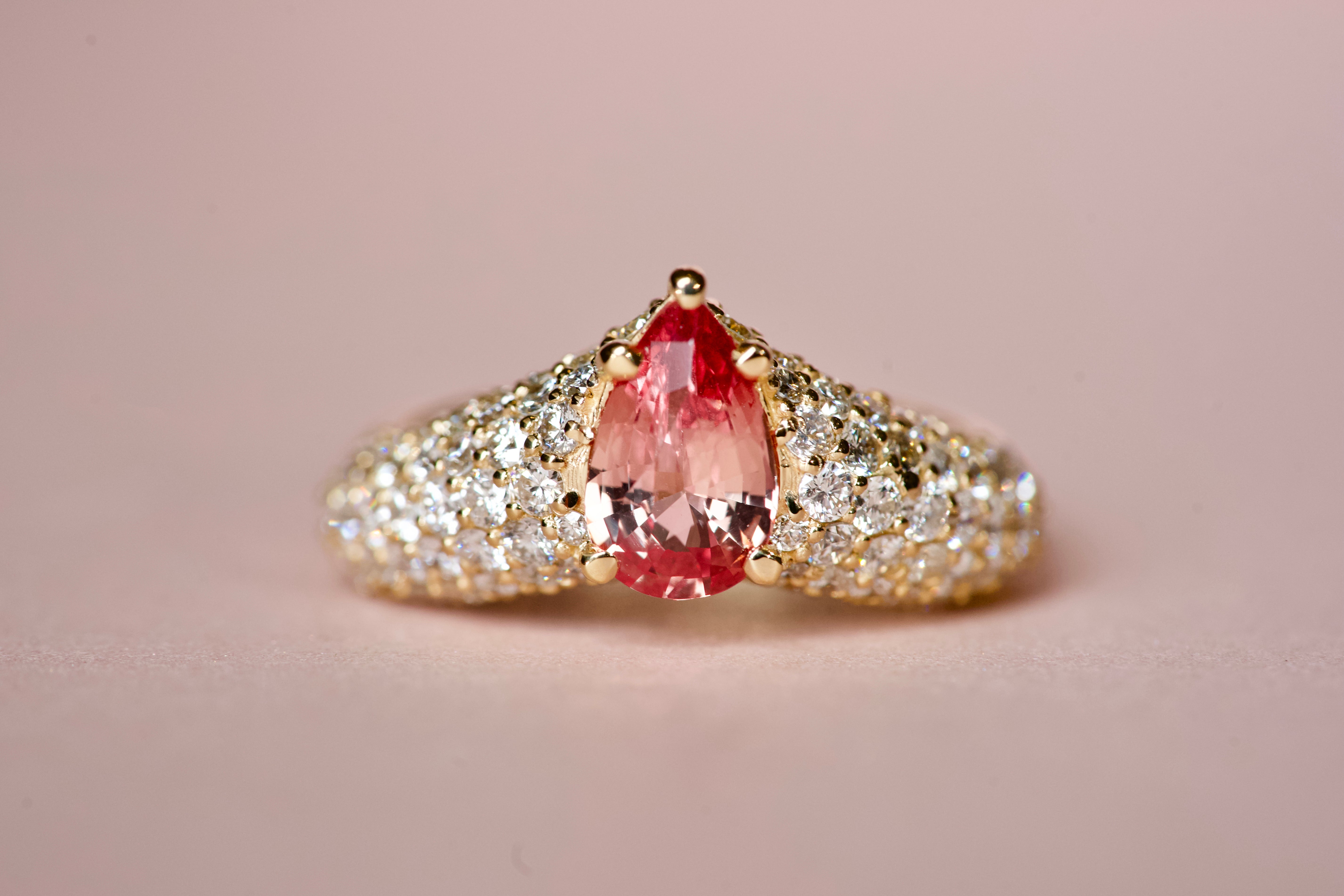 Padparadscha sapphire pear ring with diamond pavé