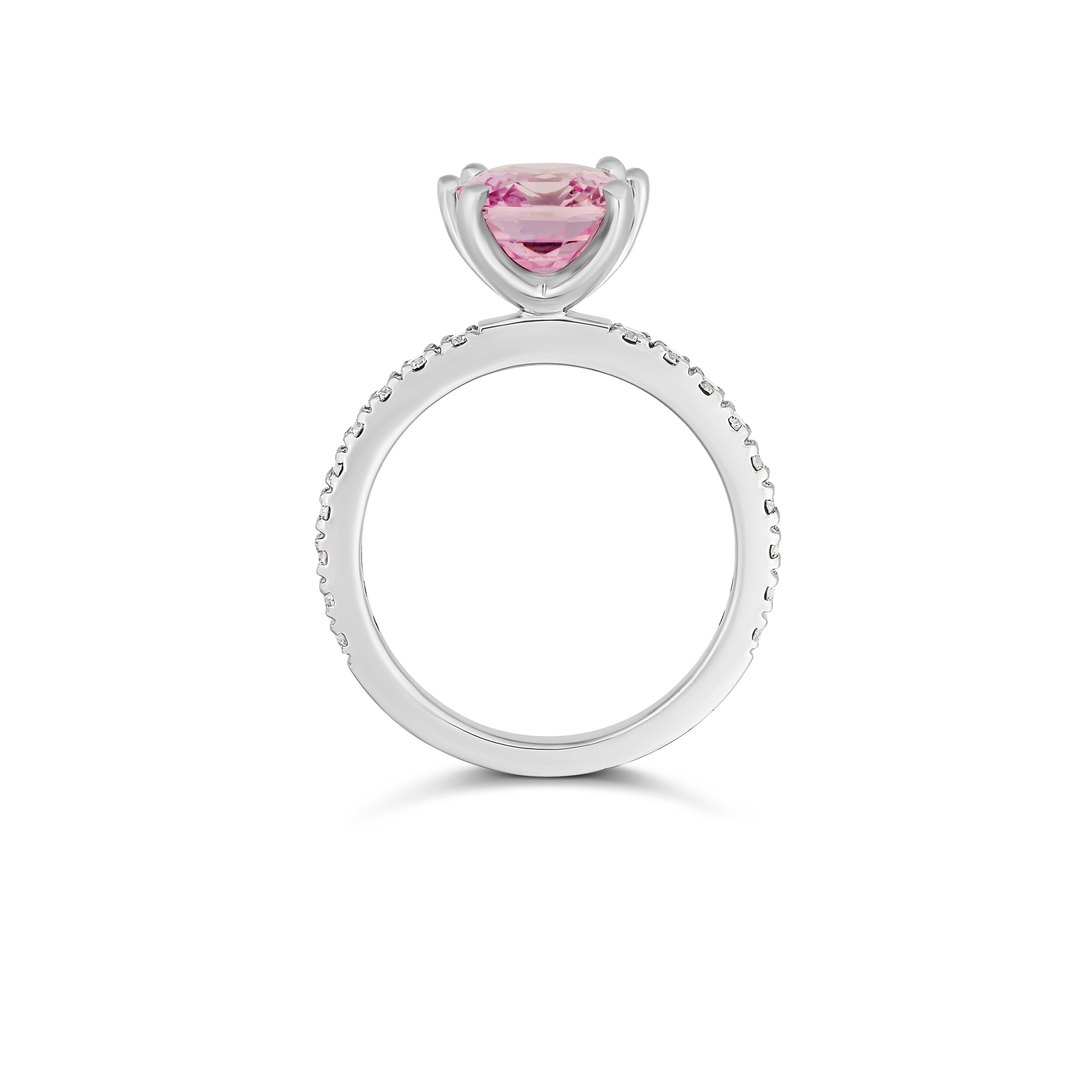 Pink sapphire halo ring in platinum, side profile