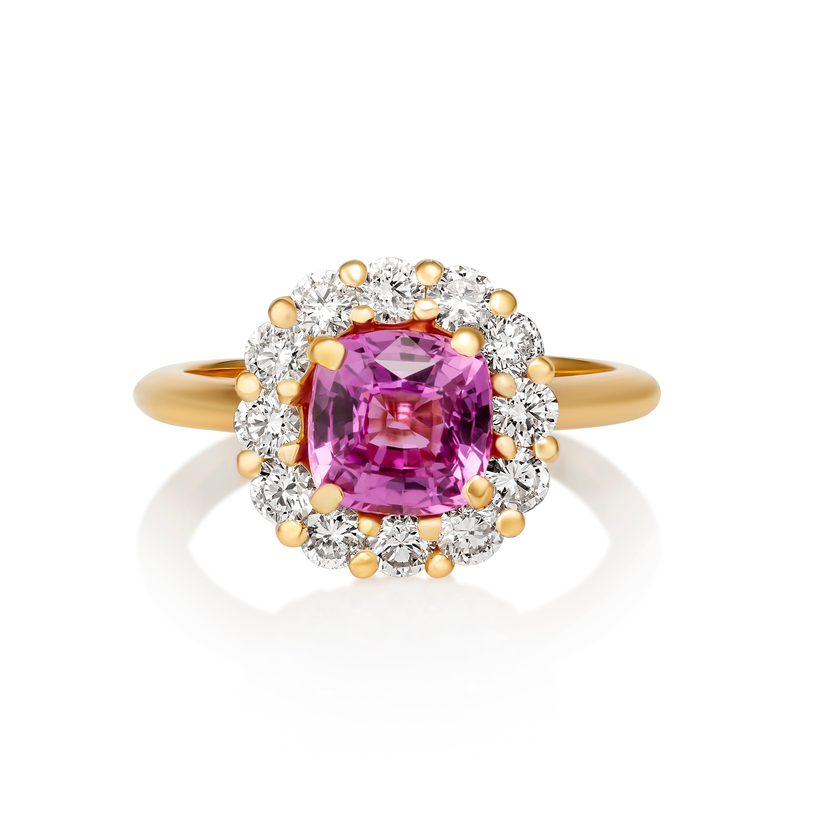 Pink sapphire halo engagement ring in yellow gold