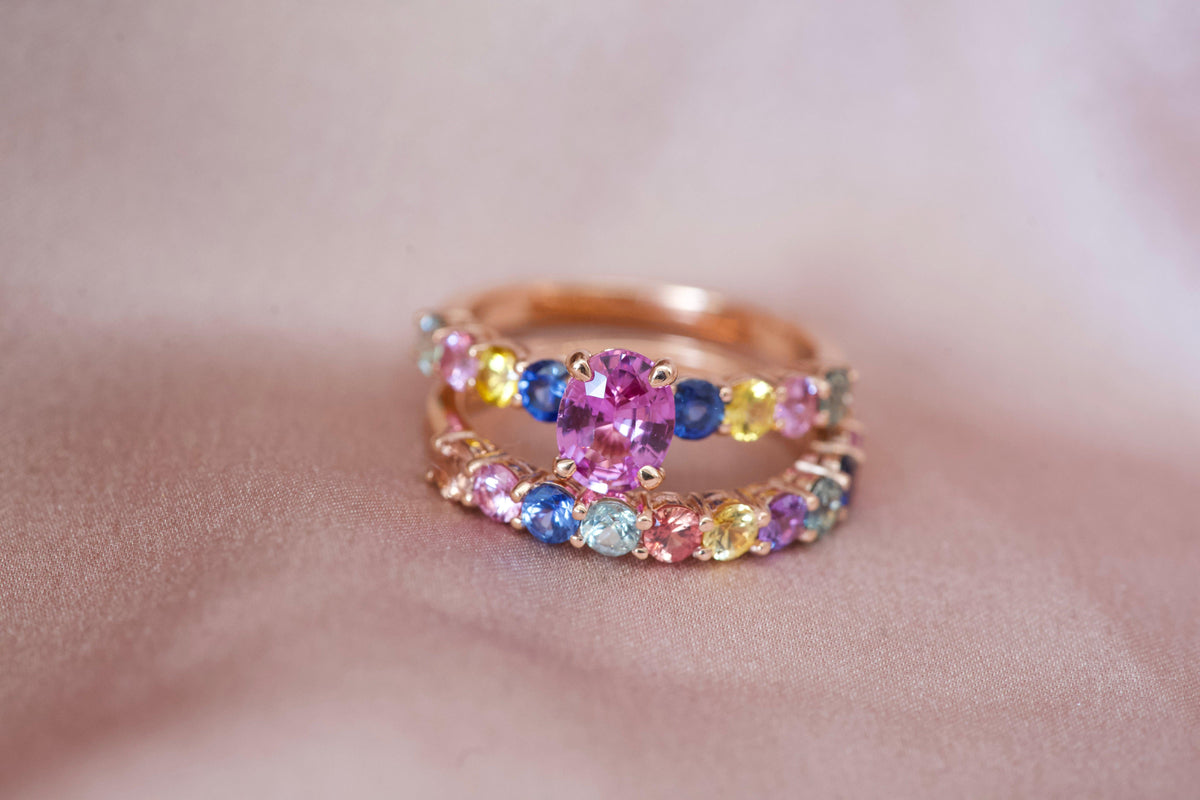 Pink sapphire ring with multicolour halo and rainbow band