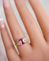 ring with a cluster of sapphires in multiple colors