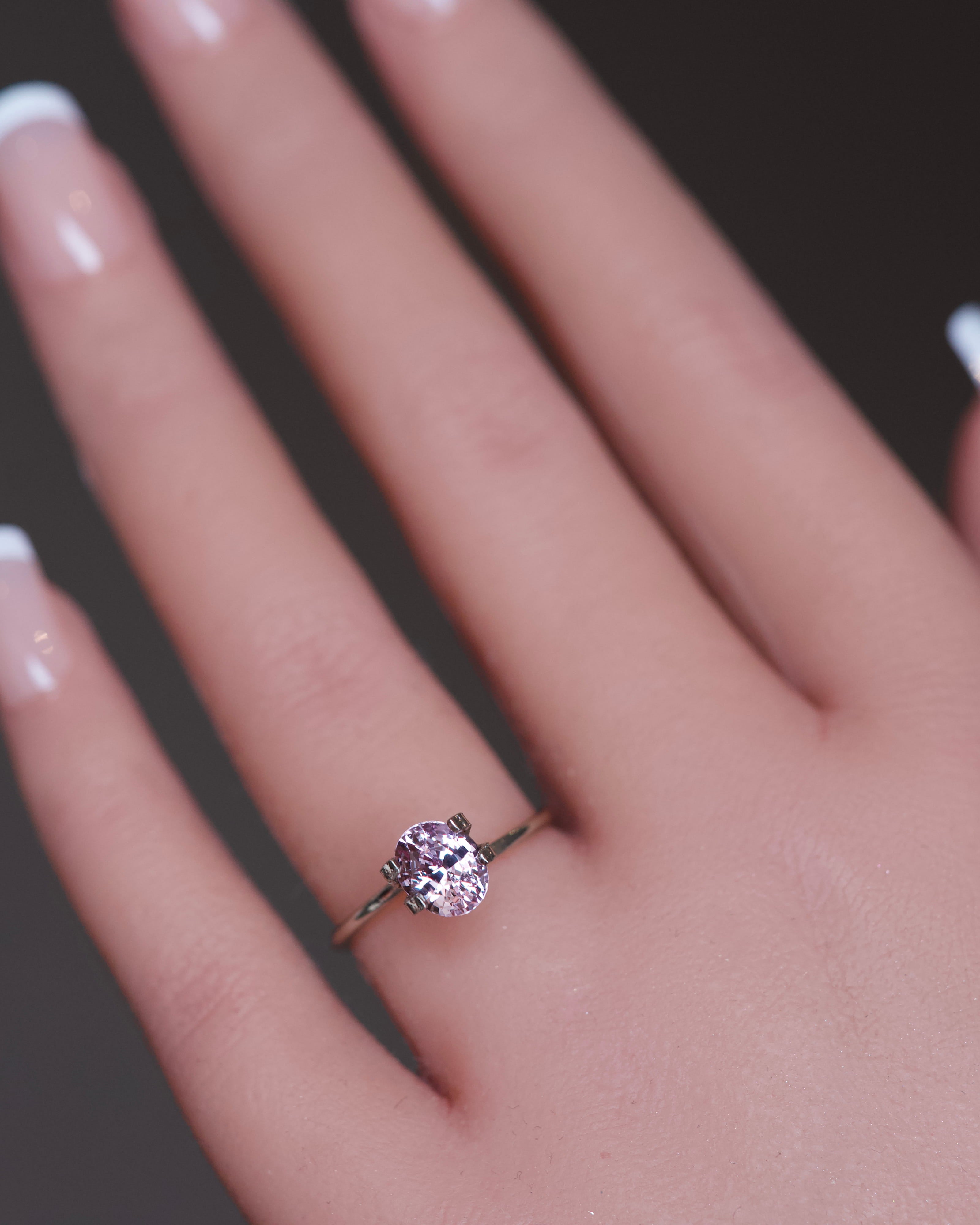 Close-up of a 2.04 carat trichromatic Ceylon fancy sapphire set in a temporary prong setting.