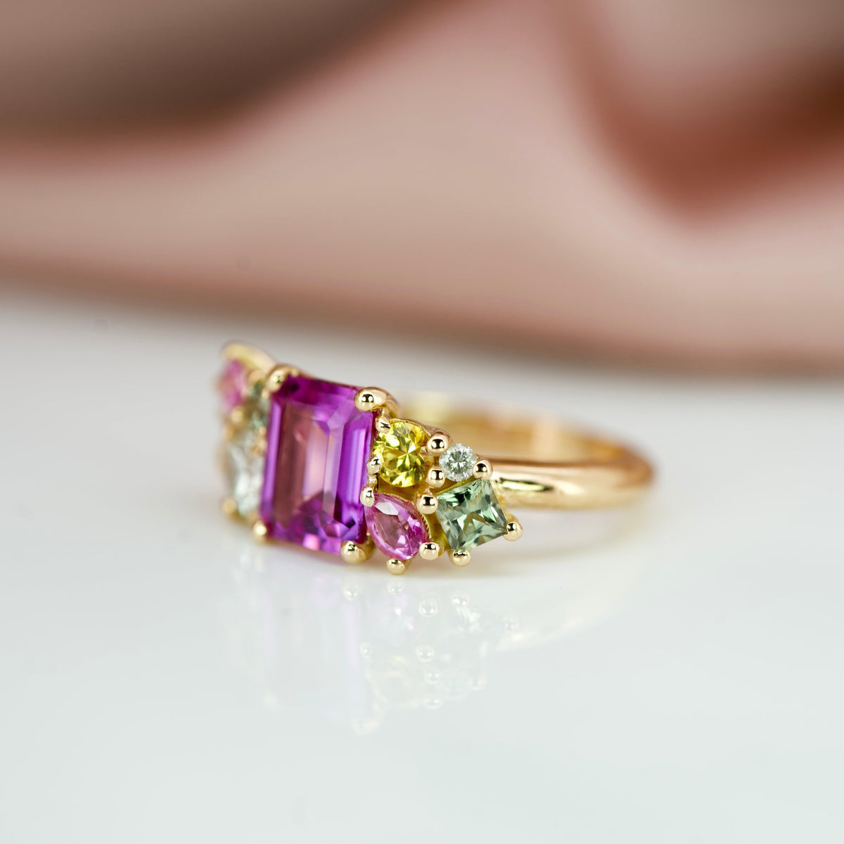 ring design with a cluster of sapphires side view
