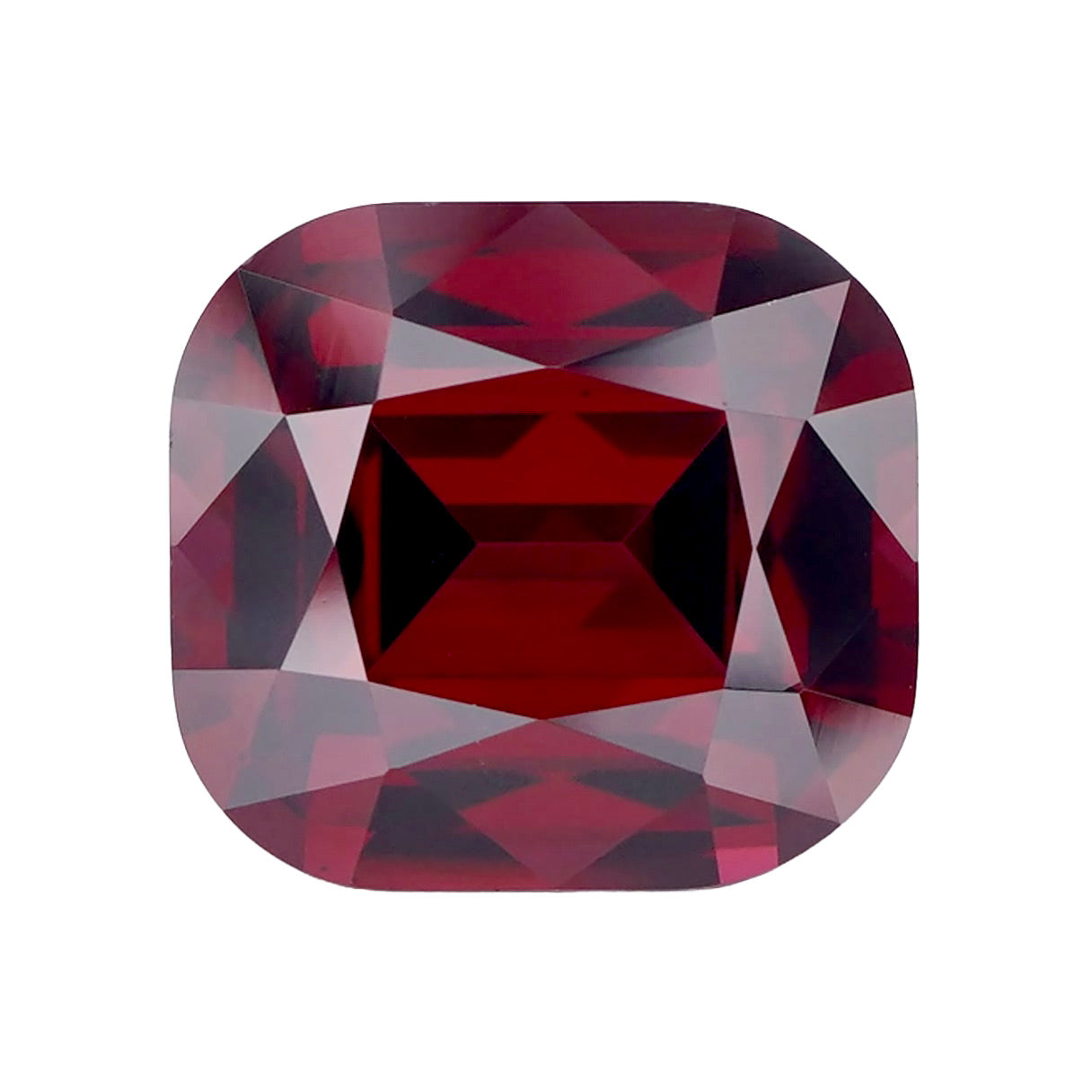 Centred view of a square-cushion purplish red rhodolite garnet stone.