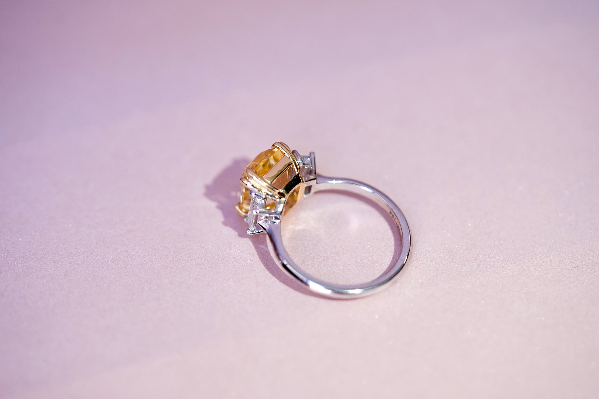 Emerald cut yellow sapphire ring, side profile view