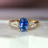 Cornflower Blue Oval Sapphire Trilogy Engagement Ring Yellow Gold