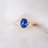 Cornflower Blue Oval Sapphire Trilogy Engagement Ring Yellow Gold