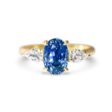 Cornflower Blue Oval Sapphire Trilogy Engagement Ring Yellow Gold