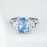 Light Blue Sapphire Trilogy Engagement Ring in Platinum