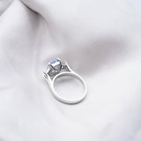 Light Blue Sapphire Trilogy Engagement Ring in Platinum
