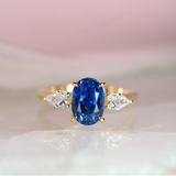 Cornflower Blue Oval Sapphire Trilogy Engagement Ring Yellow Gold