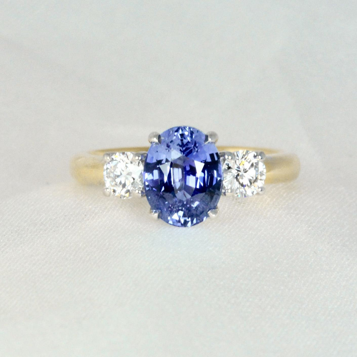 Cornflower Blue Sapphire Oval Trilogy Engagement Ring Two Tone