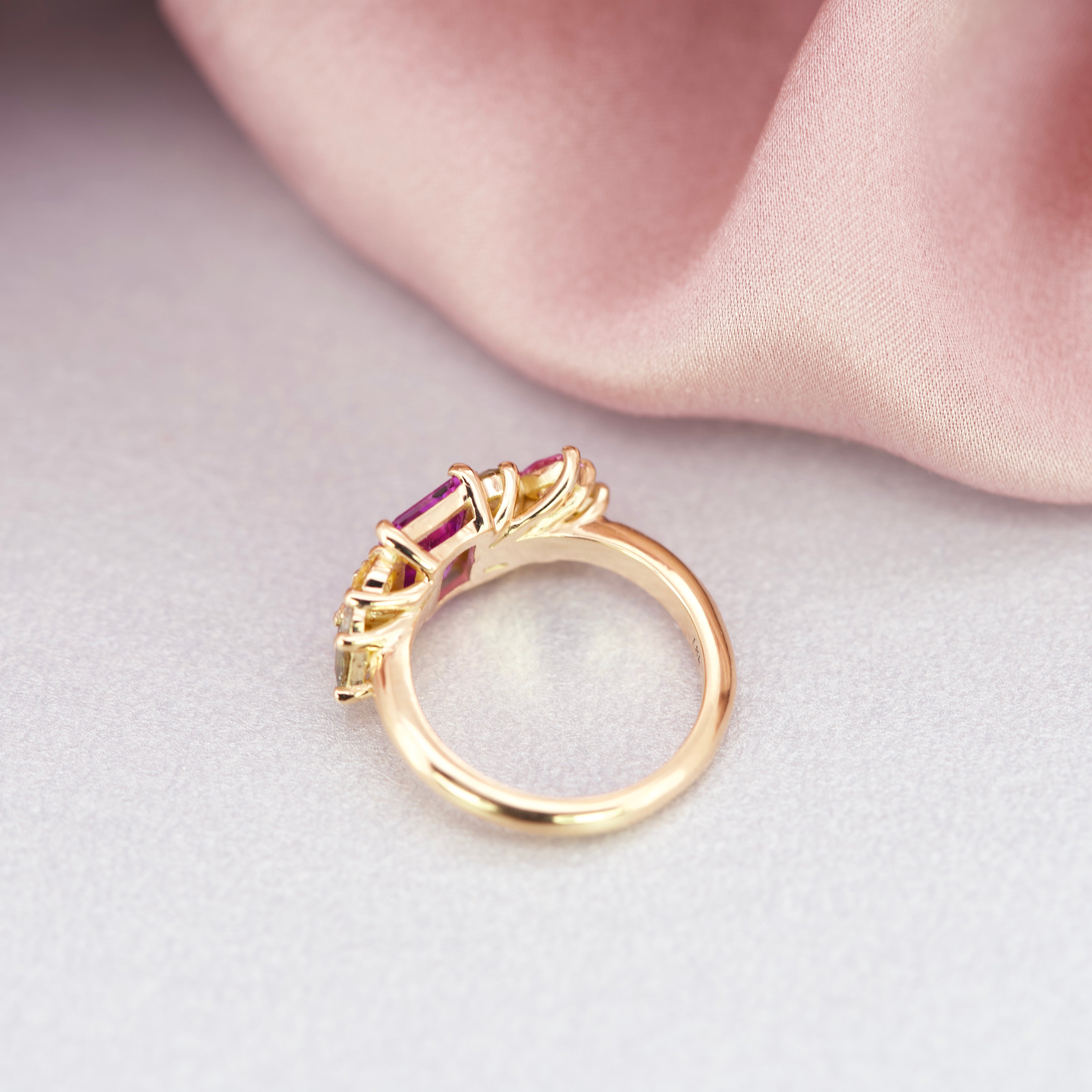 14k ring design with a cluster of sapphires 