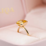 Emerald Cut Yellow Sapphire Half Bezel Set Ring