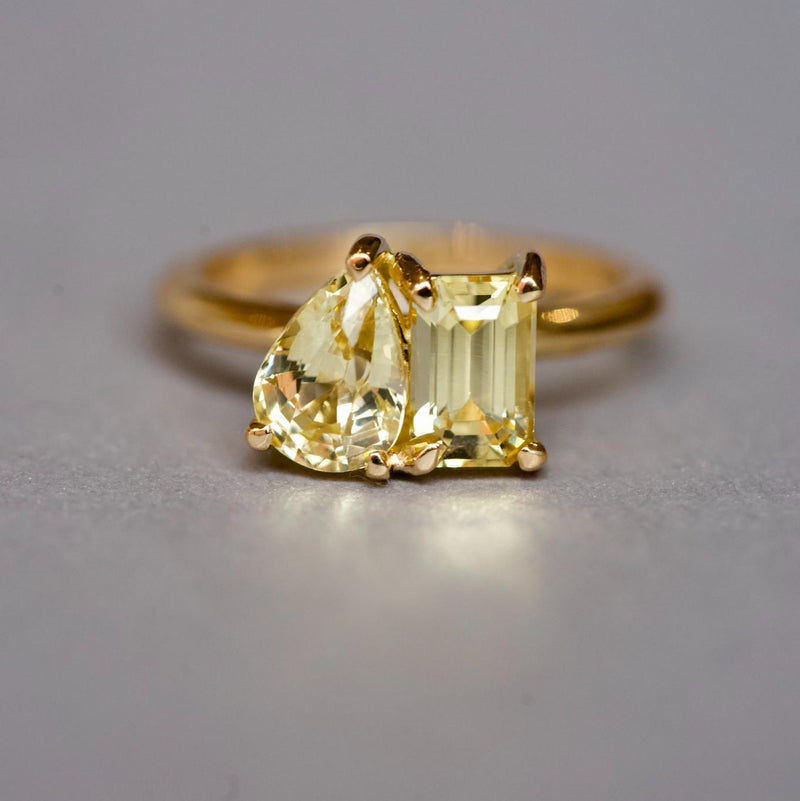 Pear and emerald cut yellow sapphire Toi et Moi ring
