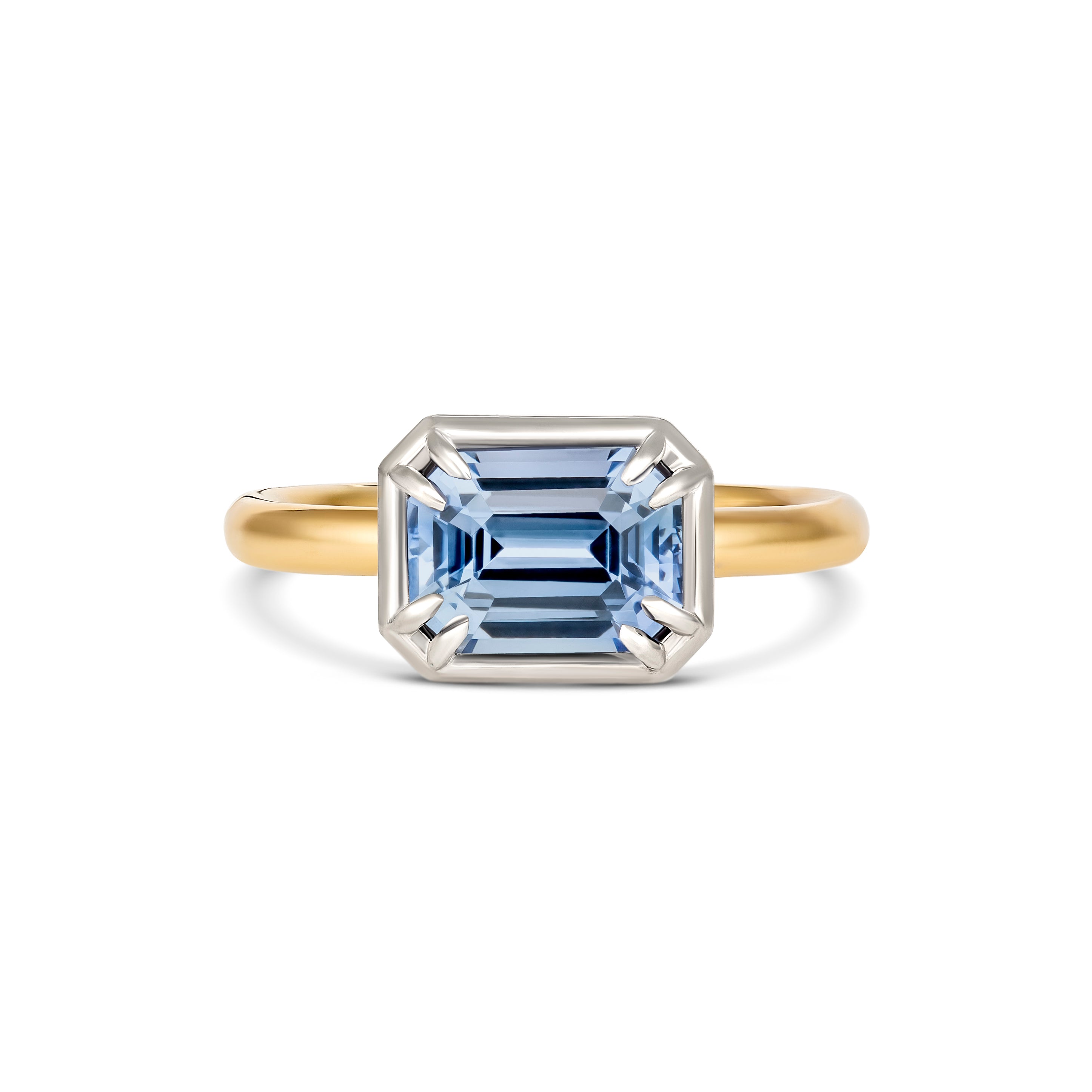 Unheated emerald cut blue sapphire two-tone engagement ring