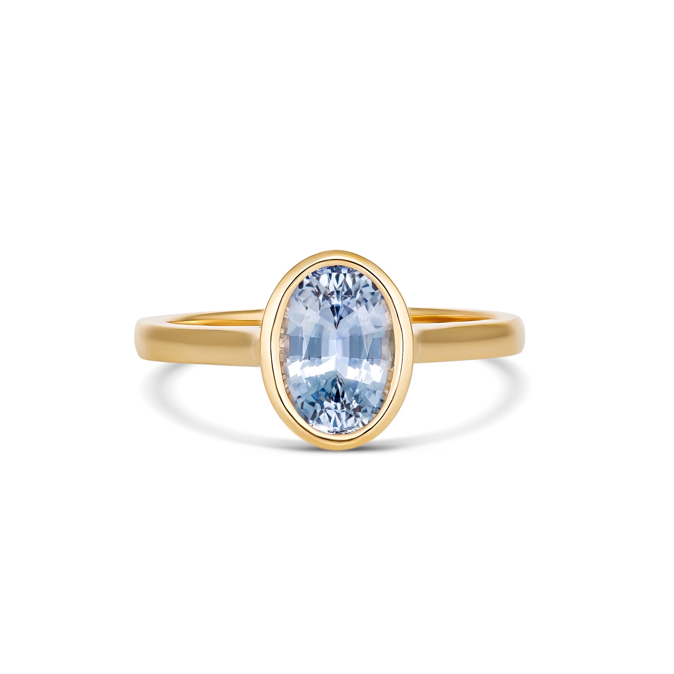 Sky blue oval Ceylon sapphire in yellow gold bezel setting