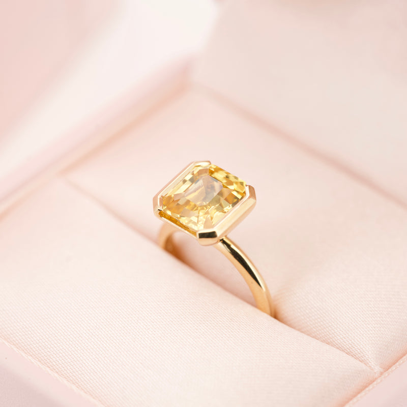 Emerald Cut Yellow Sapphire Half Bezel Set Ring