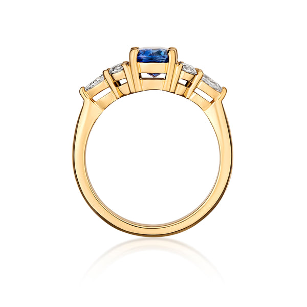 Blue sapphire cluster ring side profile in yellow gold