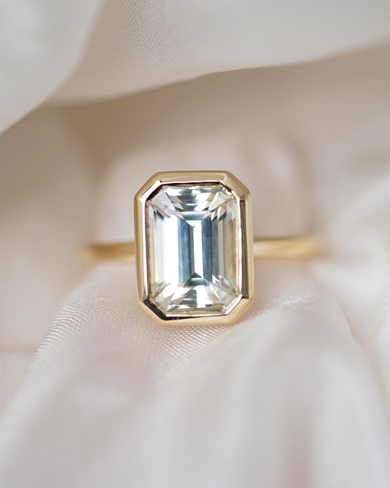 Emerald cut champagne sapphire bezel ring, top view