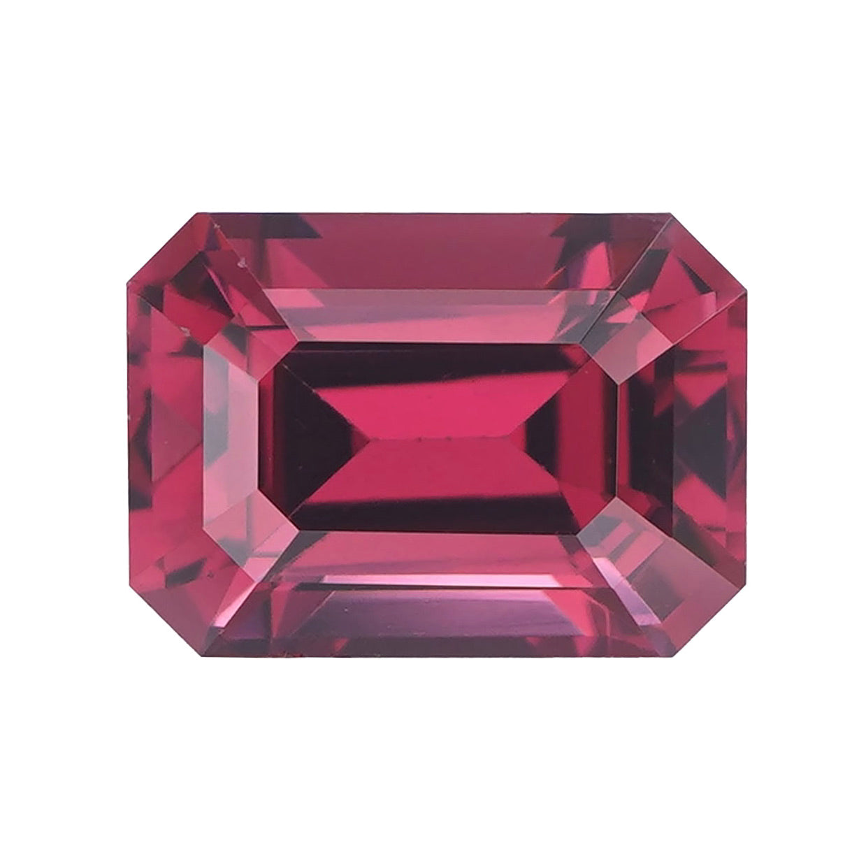 Face-up shot of a loose purplish pink emerald cut garnet.