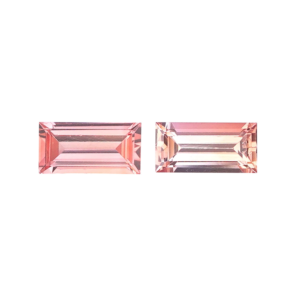 Matched pair of elongated rectangular baguette-cut padparadscha gemstones.