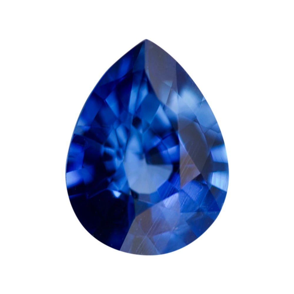 Deep royal blue pear-shaped loose gemstone on a plain white background.