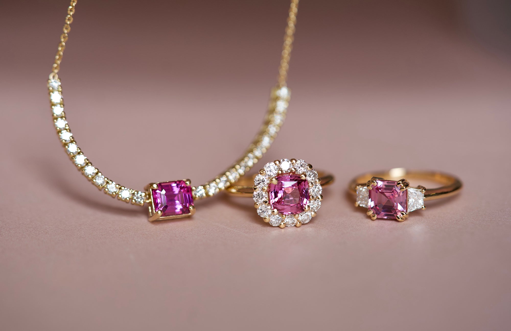 Pink sapphire necklace styled with matching rings