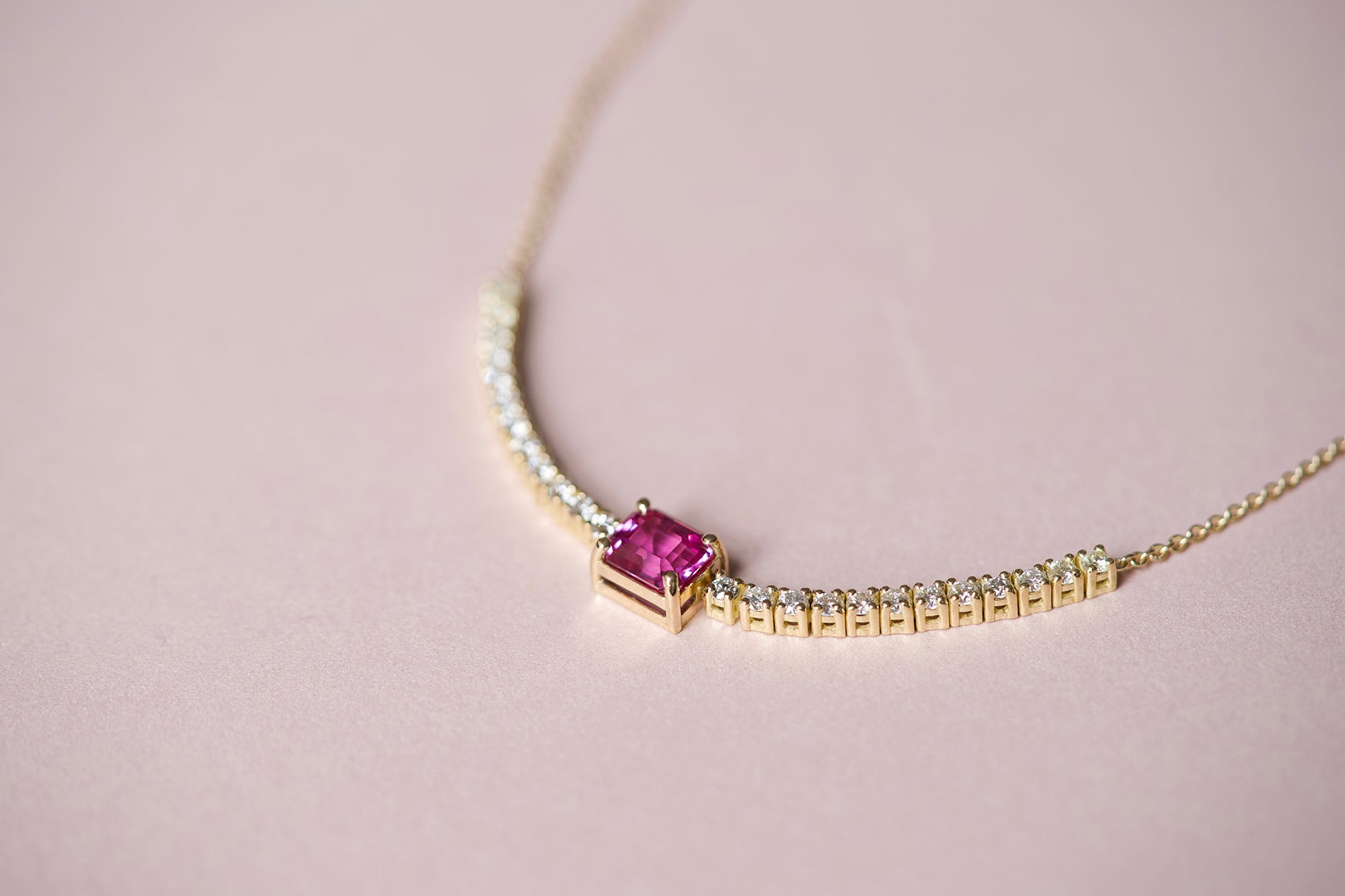Pink sapphire diamond tennis necklace, close-up view