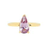 Pear shaped pink sapphire engagement ring in yellow gold