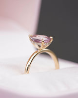 Pear pink sapphire ring with hidden diamond halo detail