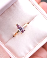 Pink pear sapphire engagement ring in presentation box